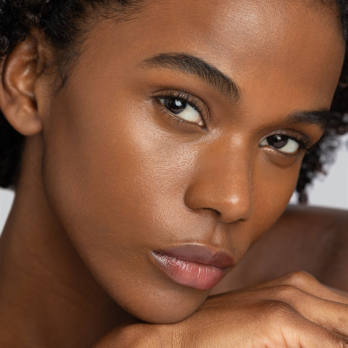 woman with a holiday glow makeup look