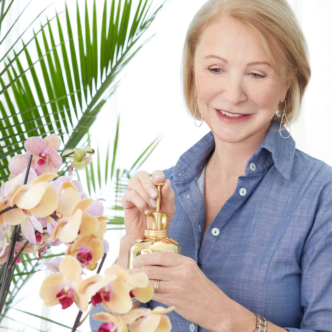 Jane Iredale watering orchids