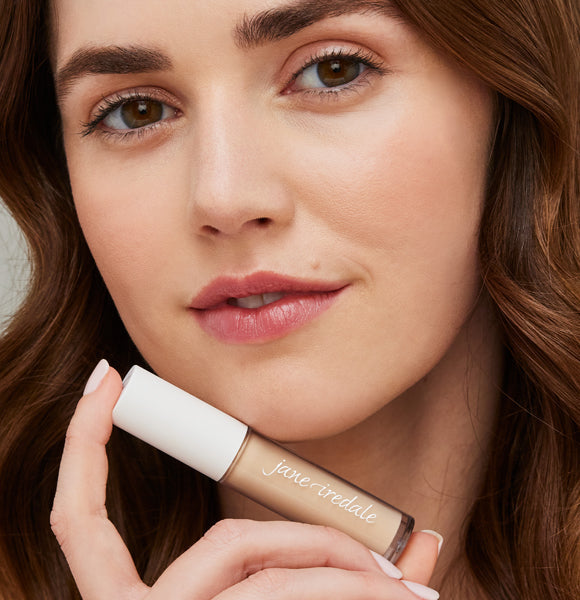 model holding purematch liquid concealer with a smooth flawless complexion